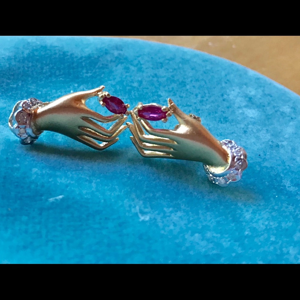 Diamond & ruby 14 karat gold stud style earrings.